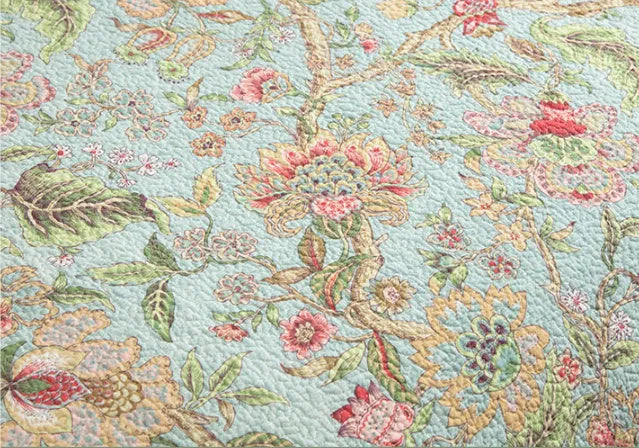 Blue floral patterned cotton bed sheet set with American bedspread styling and quilting design