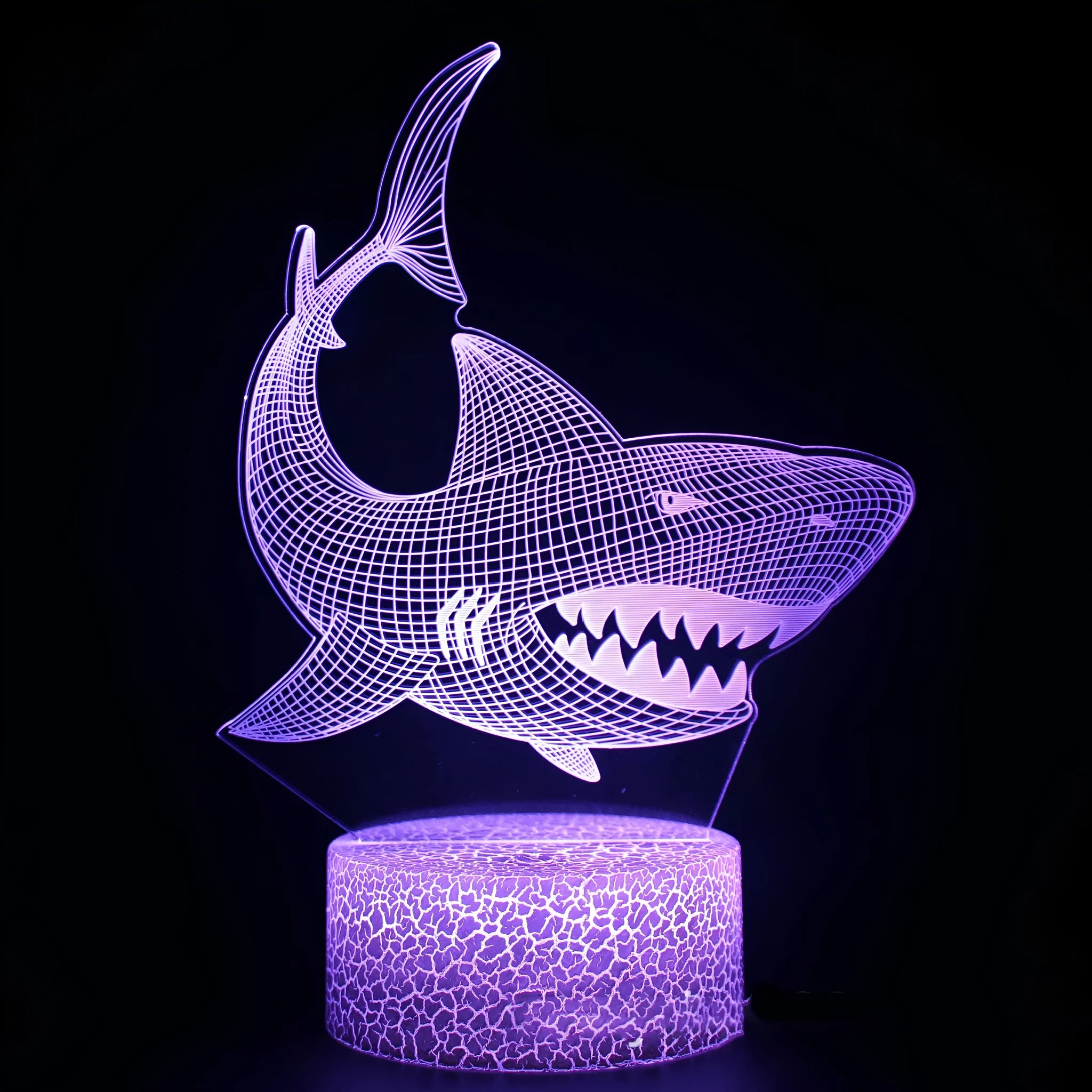 Small 3D shark-shaped LED table lamp with colourful lighting on a black ABS base.