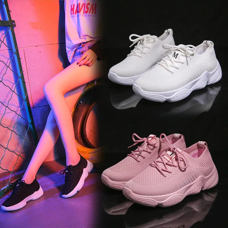 White women's thick-soled flying woven sports shoes with a front strap and rubber sole.
