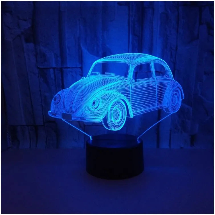 Small modern acrylic LED table lamp with a black base and USB cable on a wooden desk.