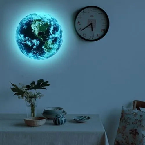 Glow in the dark 3D Earth planet wall sticker in luminous PVC material on a dark background.
