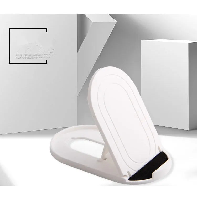 Plastic mobile phone stand with adjustable bracket in six colour options on a wooden desk