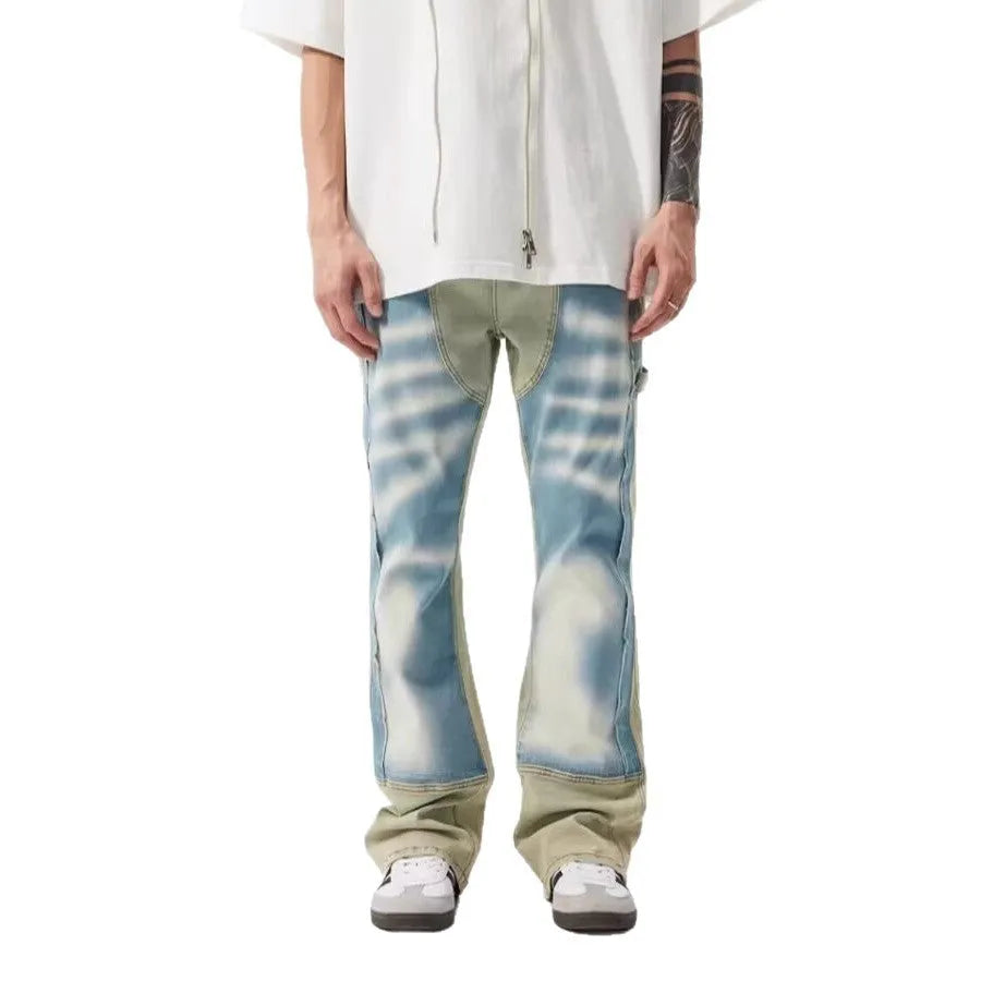 Men's yellow and blue patchwork distressed jeans with splash-ink design detail