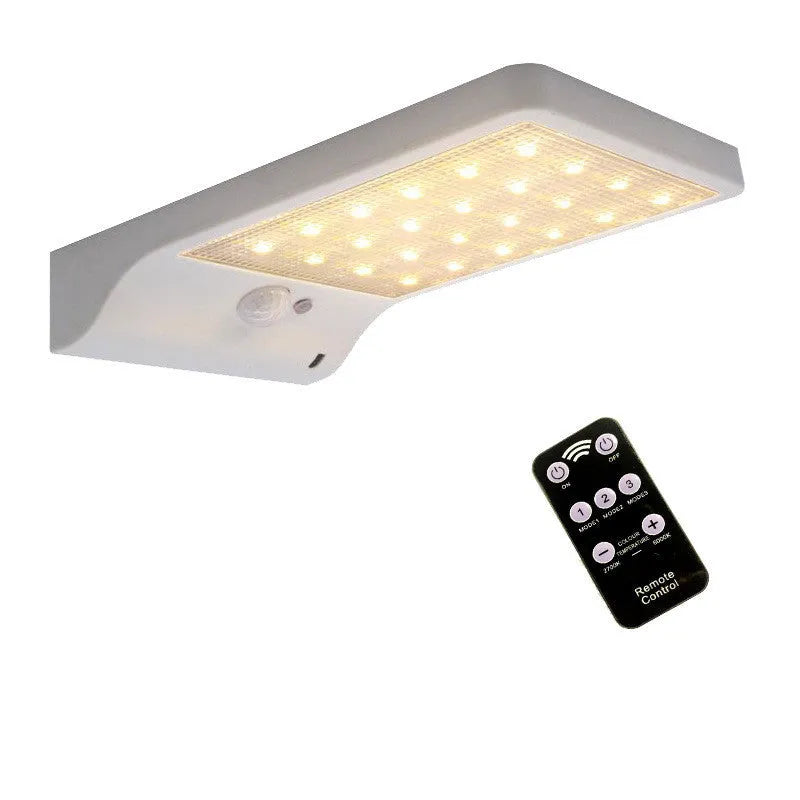 Black and white outdoor solar-powered garden lamp with IP65 waterproof rating for courtyard and balcony lighting.