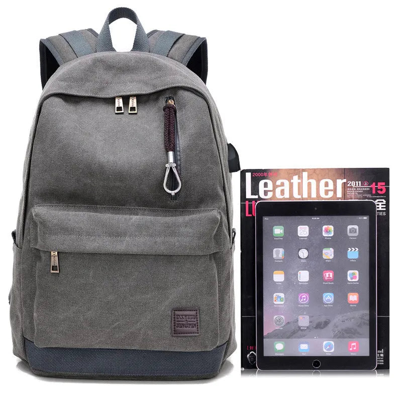 Canvas USB rechargeable backpack with laptop compartment showing multiple storage pockets