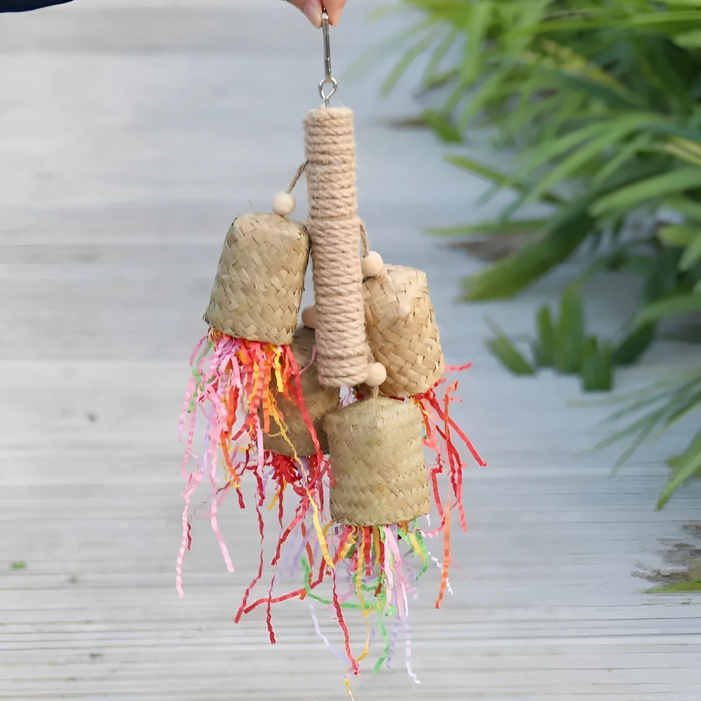 Natural wood and sisal rope parrot foraging toy with colourful shredded paper measuring 15cm by 35cm