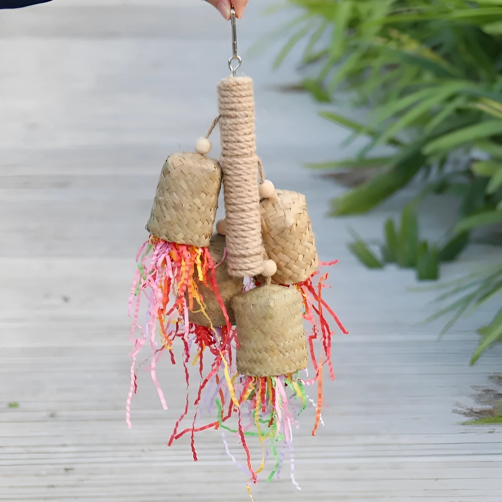 Natural wood and sisal rope parrot foraging toy with colourful shredded paper measuring 15cm by 35cm