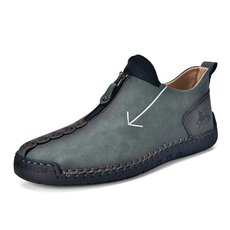 Men's black leather zip-up boots with hand-stitched detailing and round toe
