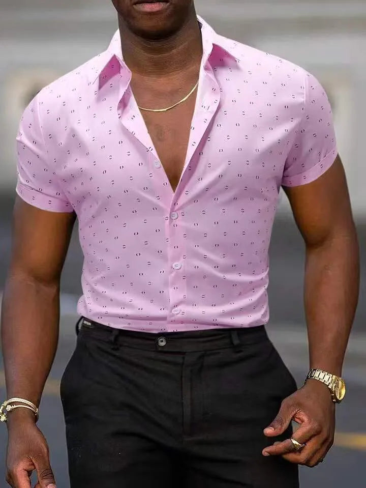 Man wearing a light blue short-sleeved shirt with an all-over floral print and a regular cardigan fit.