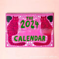 A portrait-format paper wall calendar featuring cat imagery, available for the 2024 or 2025 year.