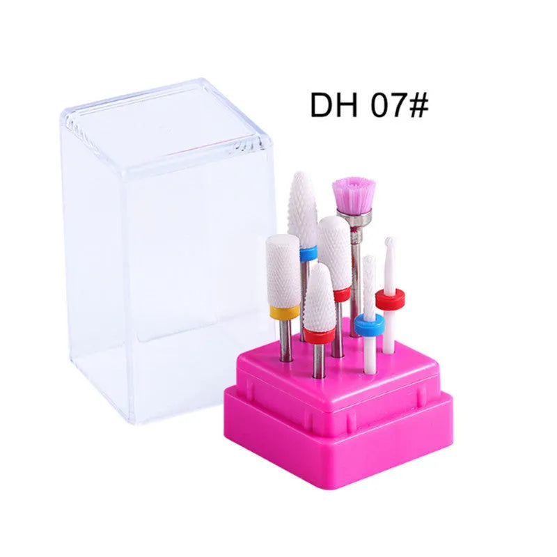 Set of seven tungsten steel nail drill bits and a brush in a clear plastic case.