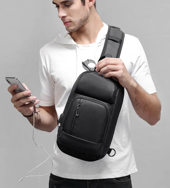 Black PVC outdoor shoulder bag with air cushion strap and multiple compartments
