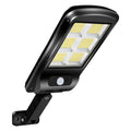 Black outdoor solar-powered motion sensor security light mounted on a wall.