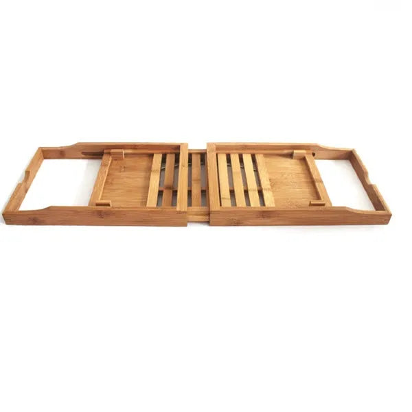 Bamboo bathtub frame storage organiser on bathroom surface holding bathing essentials