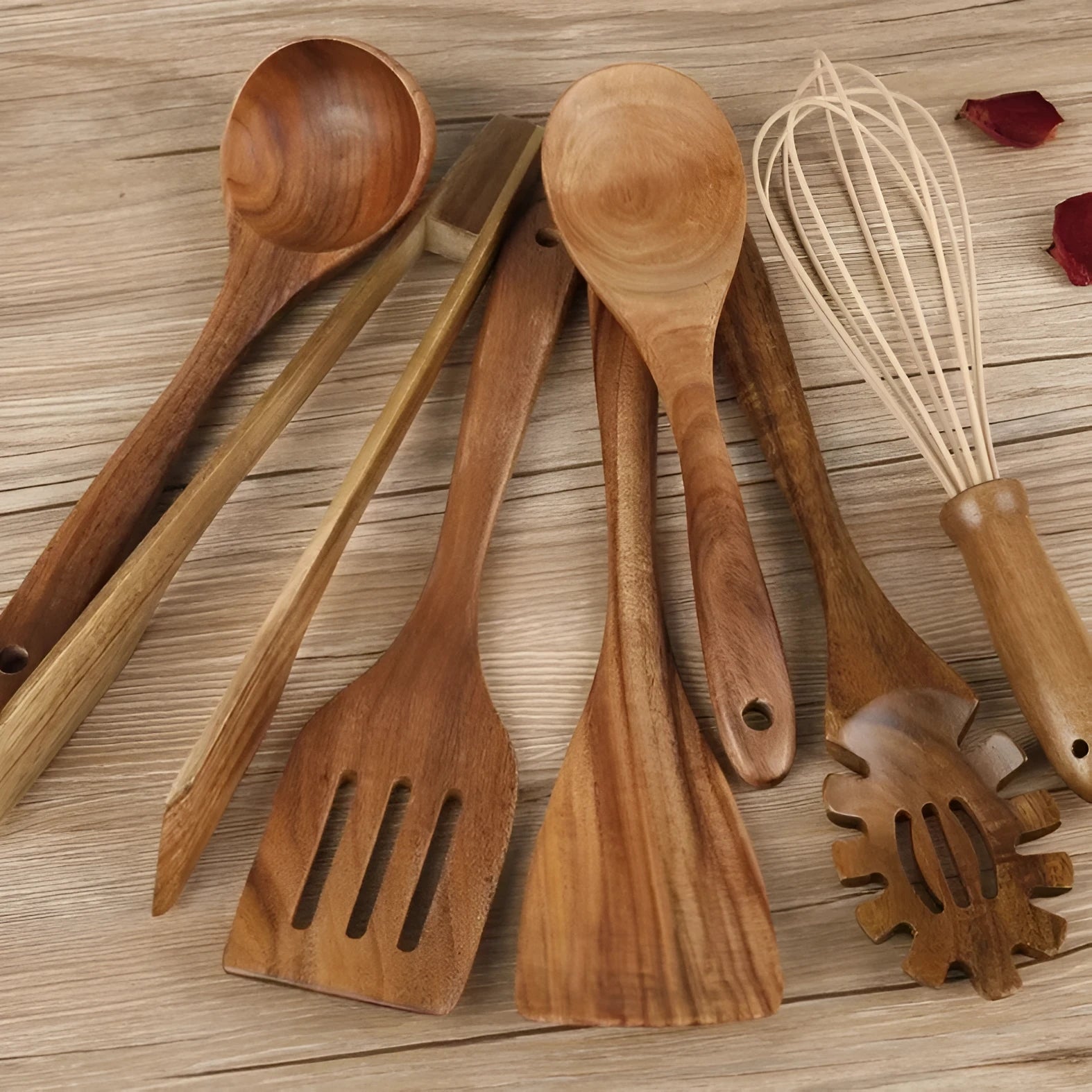 7-piece beechwood cooking utensil set including wooden spoon, spatula, ladle, and pasta fork on kitchen counter