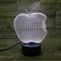 3D fruit-shaped night light with colourful LED glow on a tabletop.