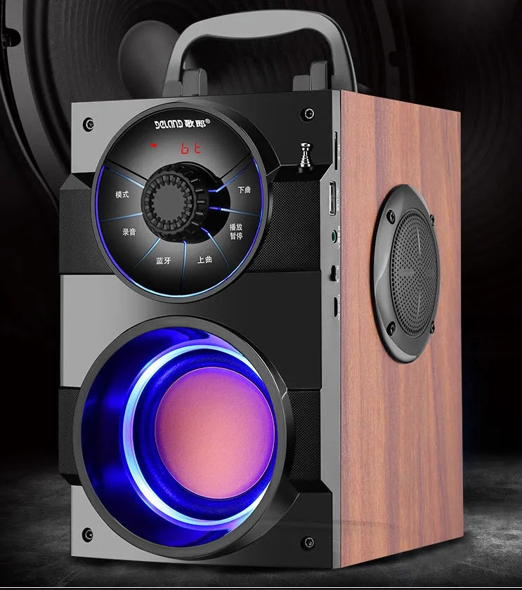Black portable mini home audio system with subwoofer, satellite speakers, and a connected USB charging cable.