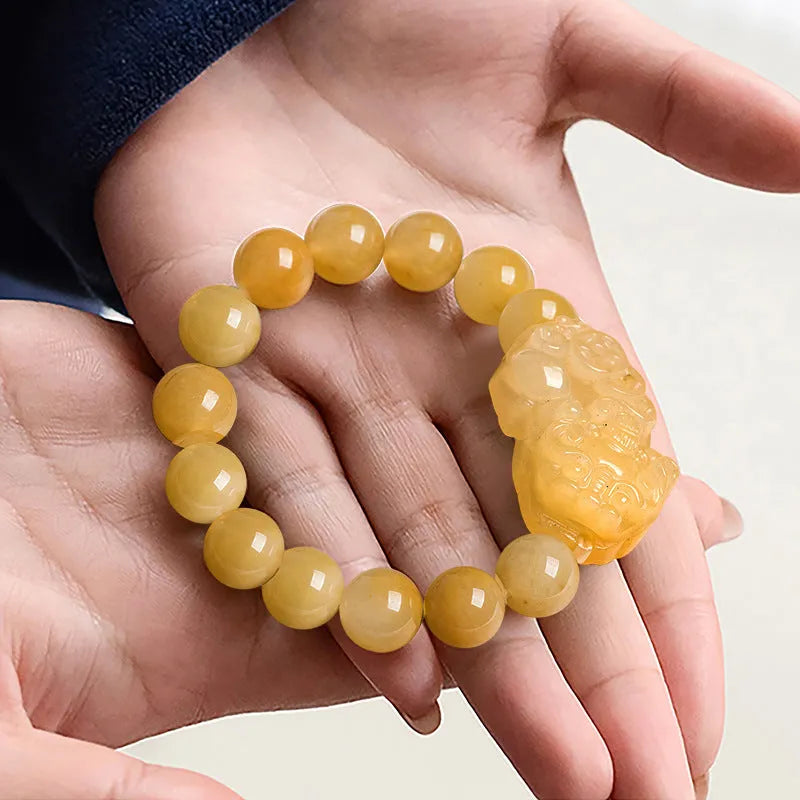 Personalised Money Jade Bracelet carved from Golden Thread Jinsi Jade, showing large and small size options.