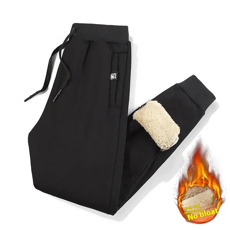 Men's grey fleece-lined cotton track pants with elastic waistband shown on hanger