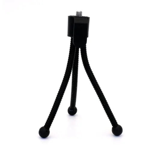 Small silver iron mini tripod with ball head, shown folded next to an iPhone for scale.