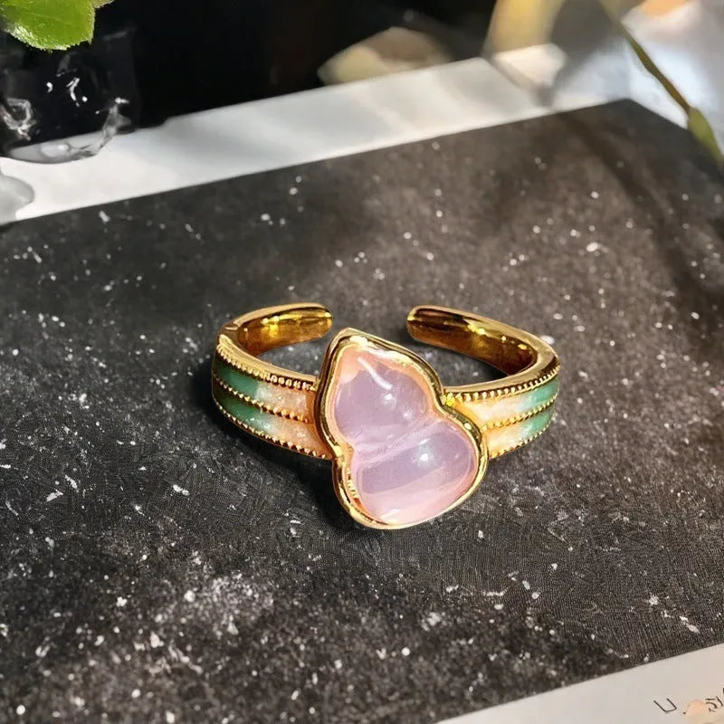 Copper adjustable ring with gourd, flower, and bow design featuring inlaid zircon stones in vintage finish.