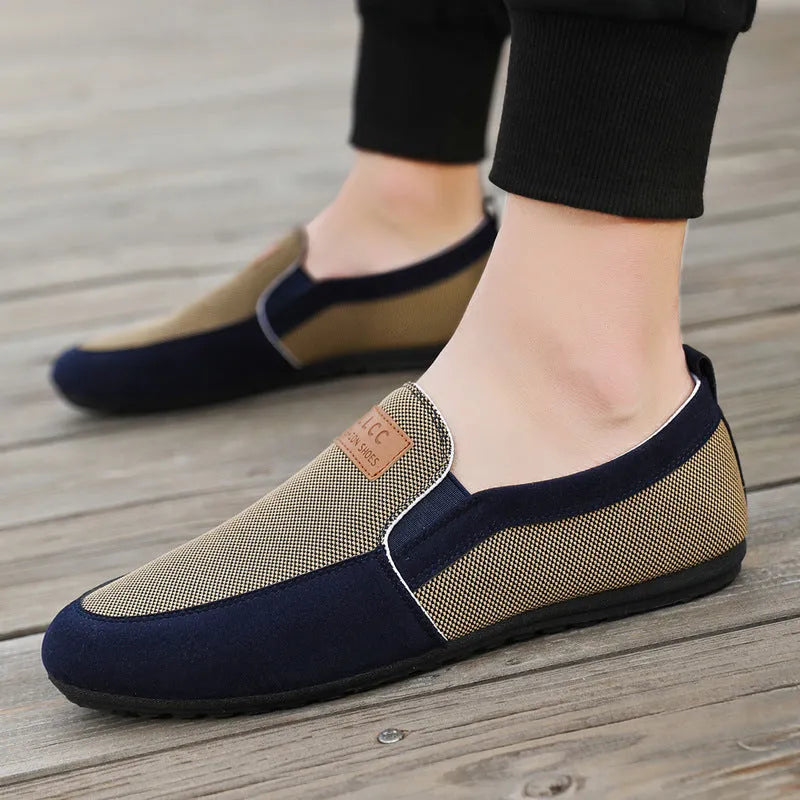 Men's grey and khaki canvas casual board shoes with round toe and stitching detail.