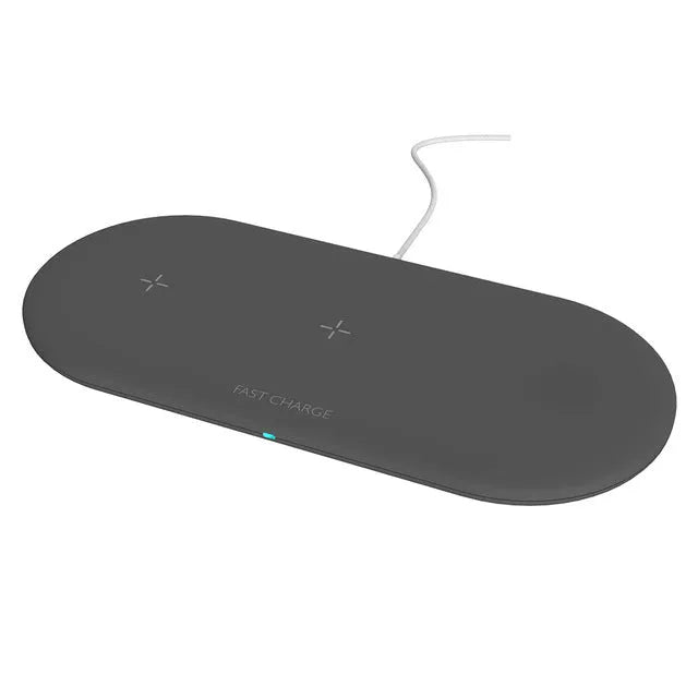 A black or white 3-in-1 wireless charging station for Apple iPhone, watch, and headphones on a desk.