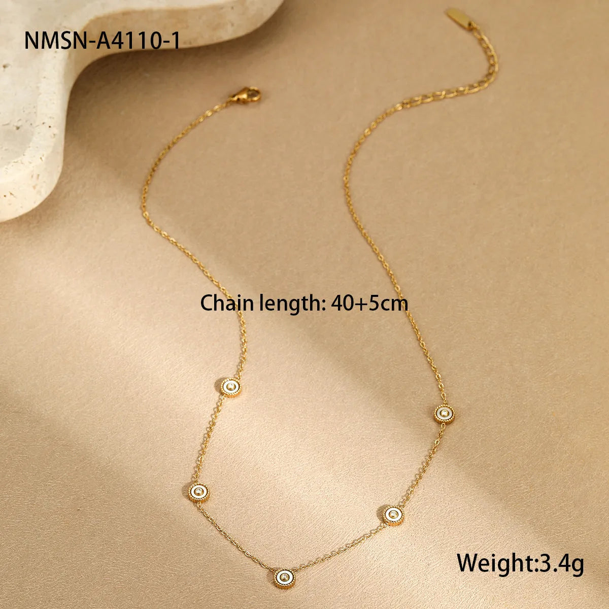 Geometric fritillary pattern stainless steel bracelet with 18K gold plating and matching necklace
