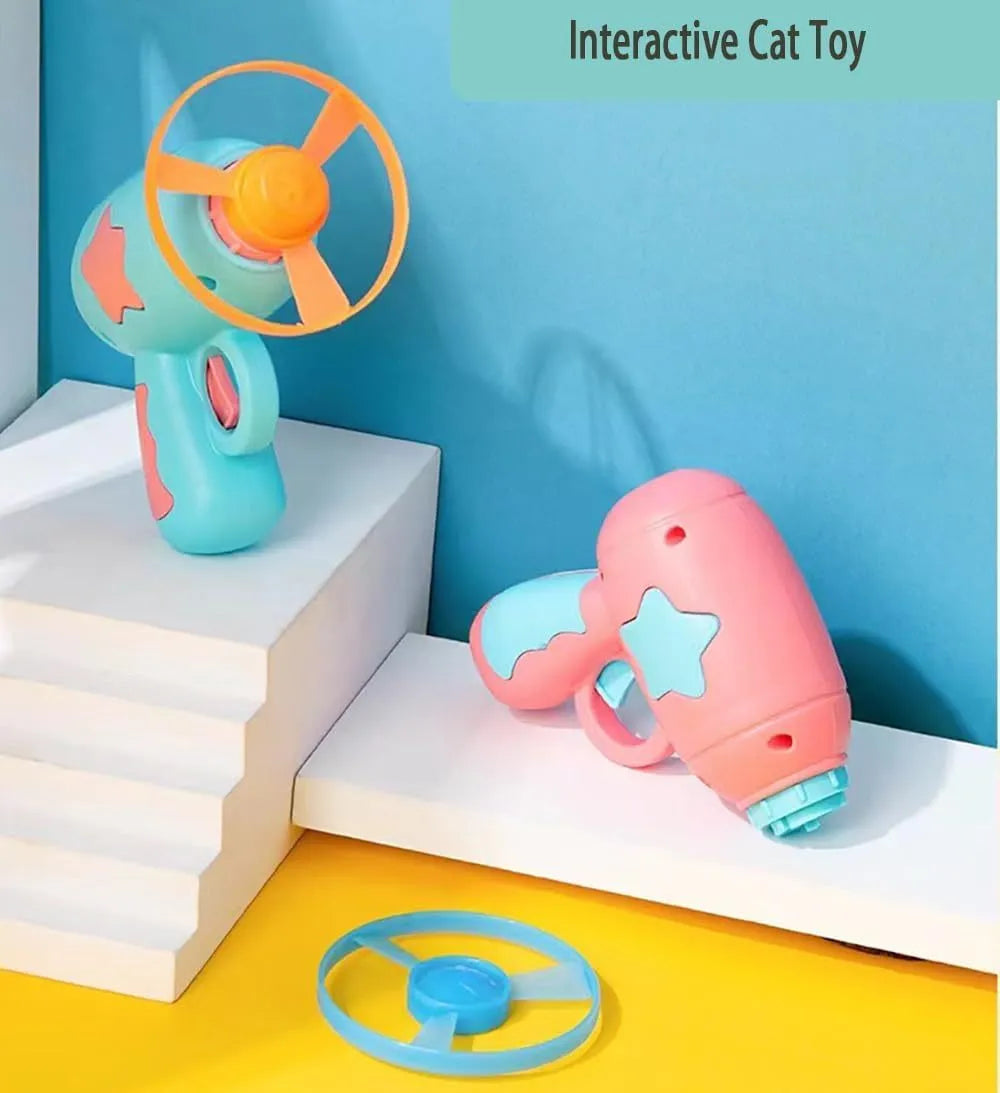 Blue interactive cat toy gun with spinning plastic frisbee for indoor feline play