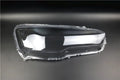 Transparent plastic vehicle headlight housing cover showing dimensions.