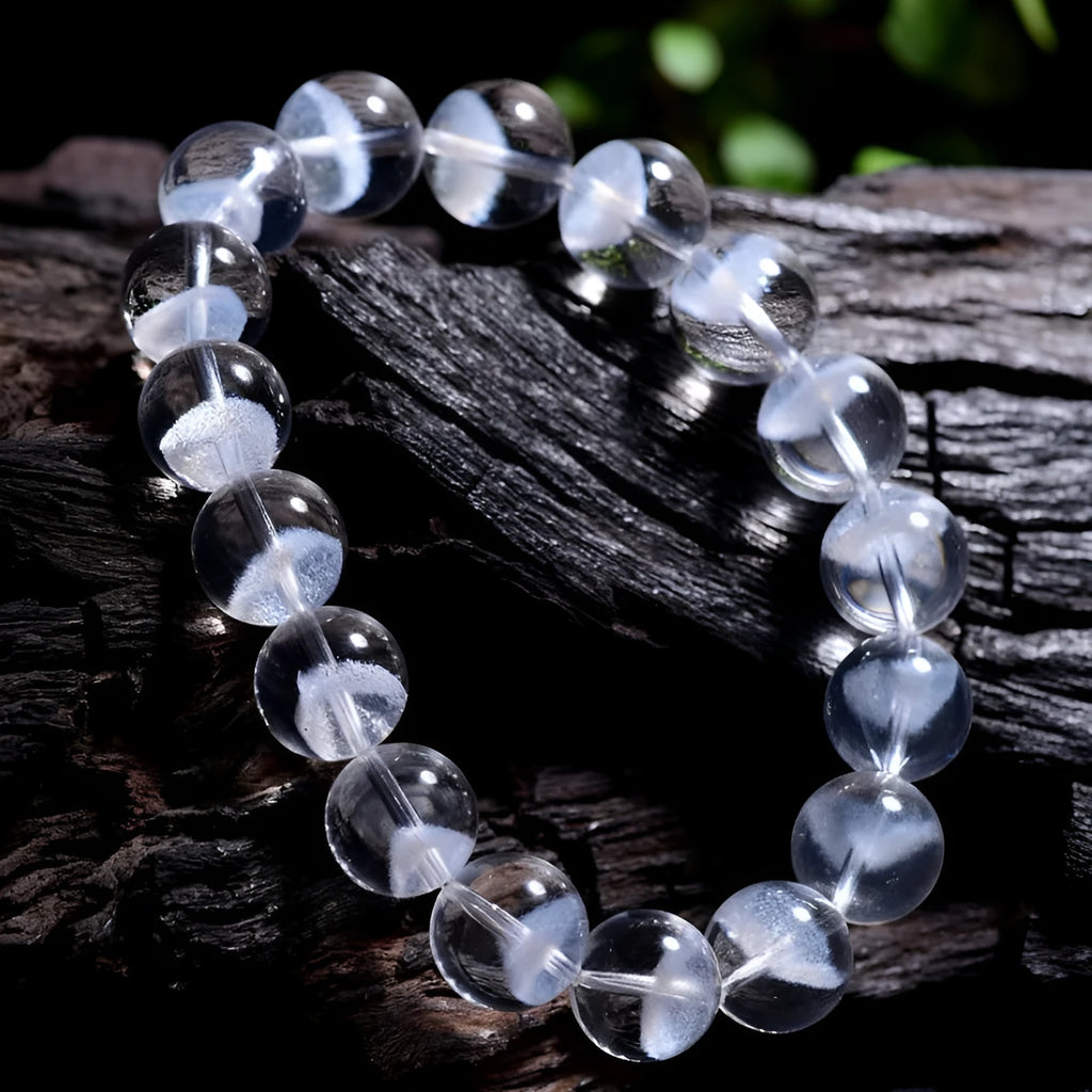 Women's natural white ghost pyramid bracelet with ground crystal beads and Ruyi design element
