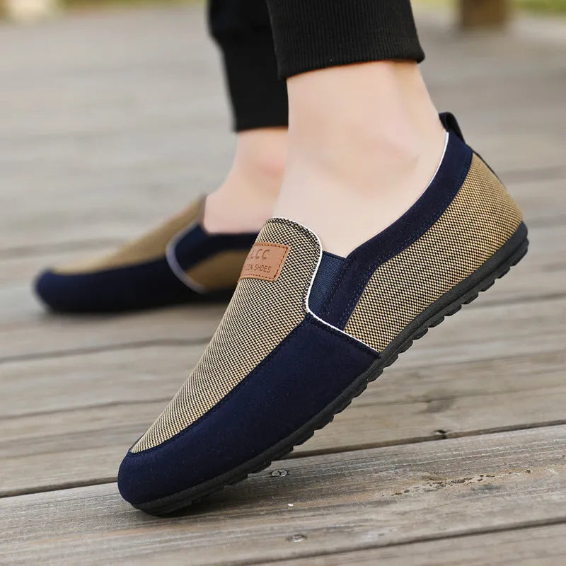 Men's grey and khaki canvas casual board shoes with round toe and stitching detail.