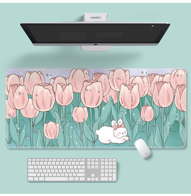 Large floral cartoon pattern mouse pad on a desk, showing non-slip rubber base and colourful design.