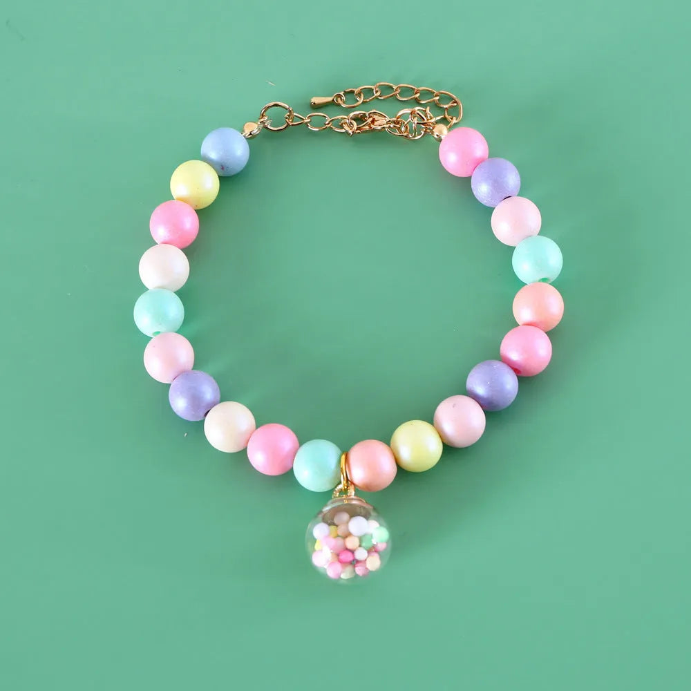Pastel macaron charm pet collar with moon and rabbit designs on adjustable resin band for cats and dogs