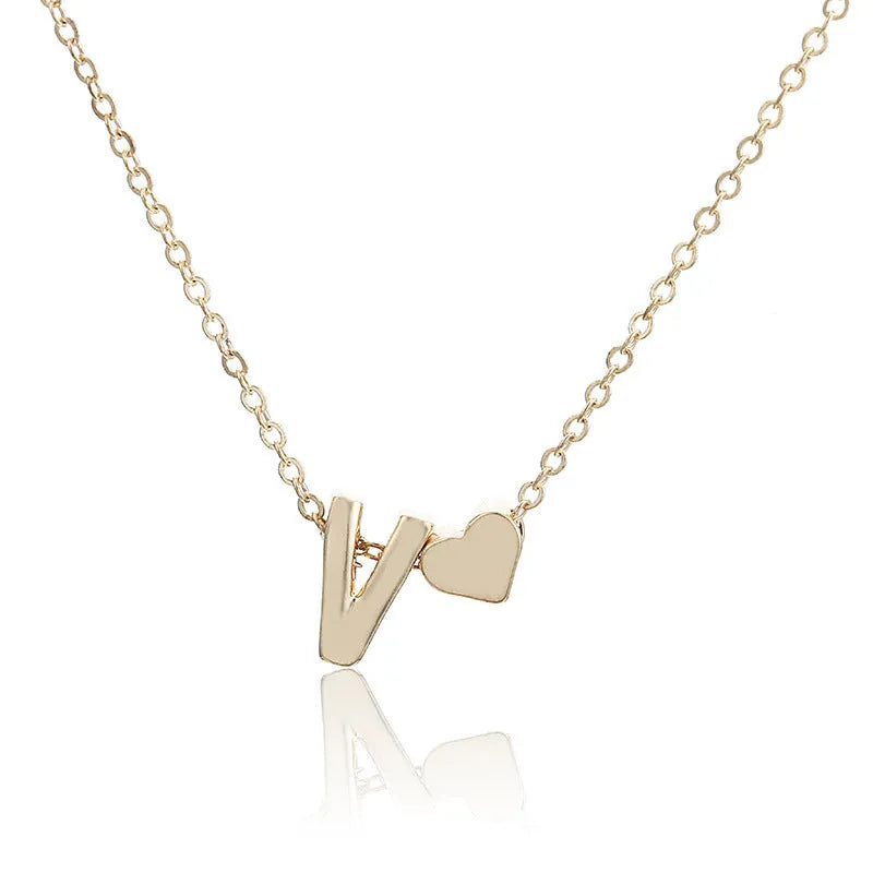 Peach heart shaped pendant with initial letter in gold or silver alloy jewellery
