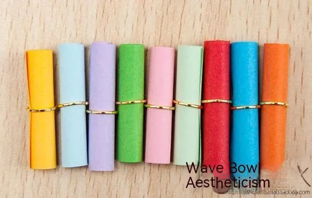 Assorted colourful paper scrolls with metal eyelets for messages and craft projects.