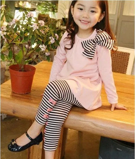 A pink cotton girls clothing co-ordinated set available in sizes 110cm, 120cm, 130cm, and 140cm.