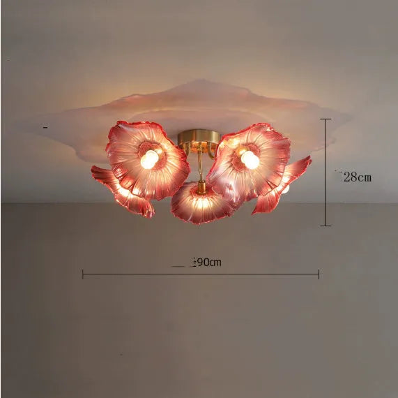 Modern white flower ceiling lamp with five light heads emitting a warm glow in a living room.