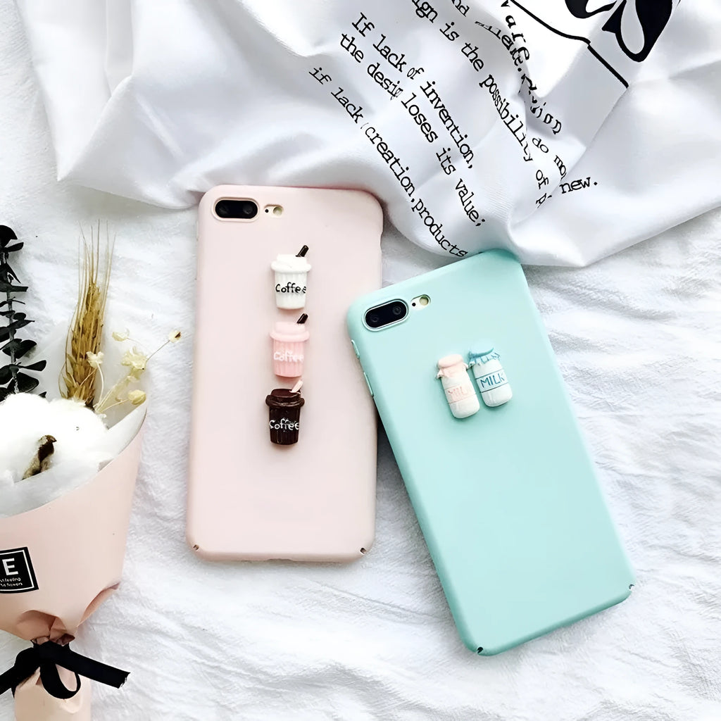 Soft silicone TPU iPhone case with a raised 3D cartoon cat design, shown in various colours.