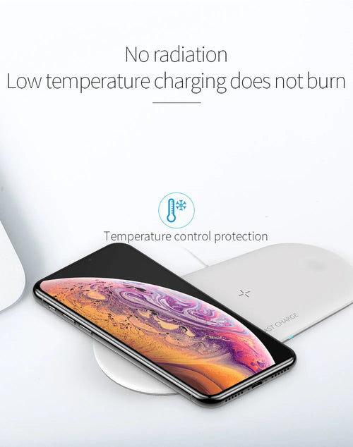 A black or white 3-in-1 wireless charging station for Apple iPhone, watch, and headphones on a desk.