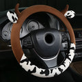 Short plush automotive steering wheel cover with protective handle in black colour