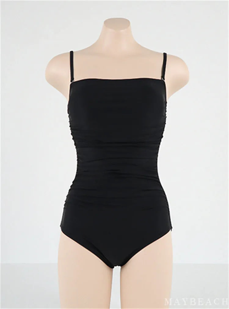 Sling style one-piece swimsuit with belly pleats in blue colour