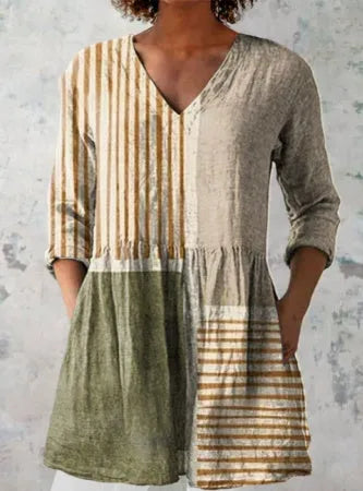Women's printed loose wave dress with wide waist and three-quarter sleeves in a floral pattern.