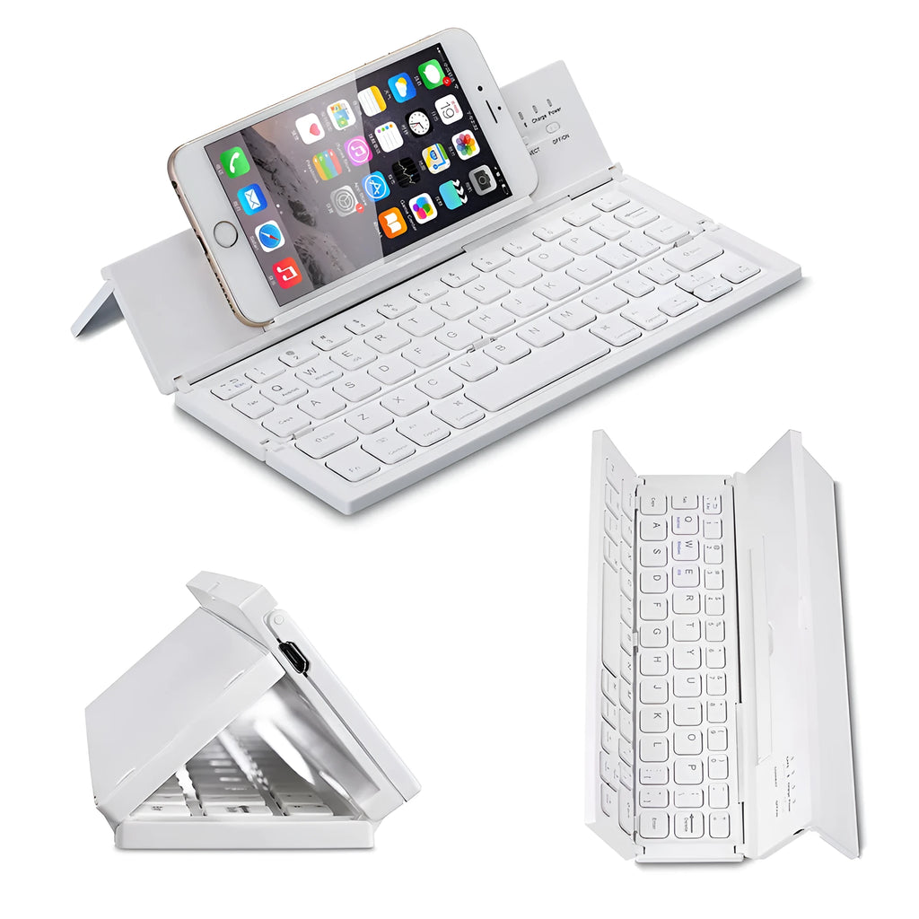 A black mini folding wireless Bluetooth keyboard shown open next to a tablet.