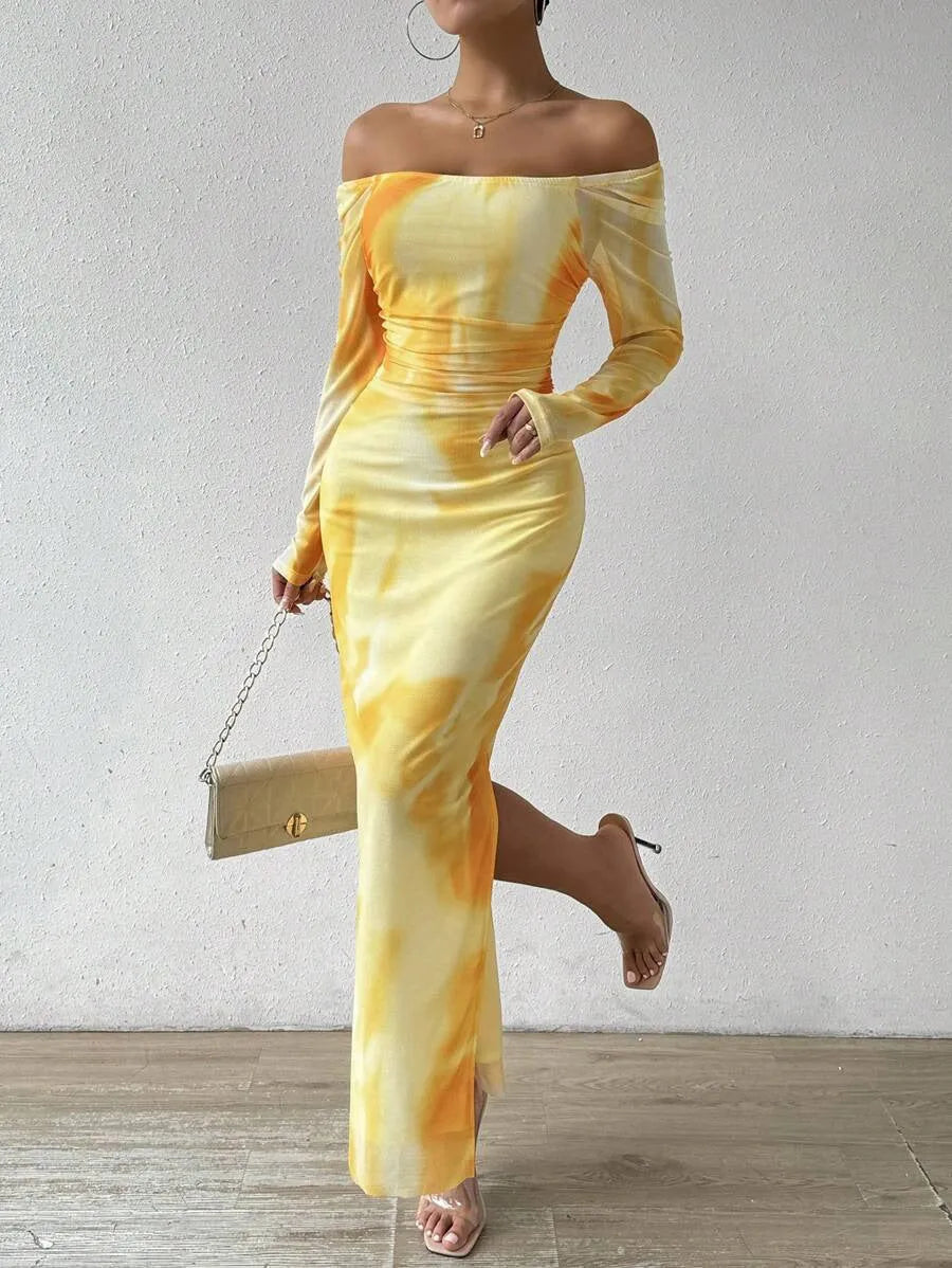 Womens long printed mesh fishtail dress with gradient colour pleating and split skirt detail