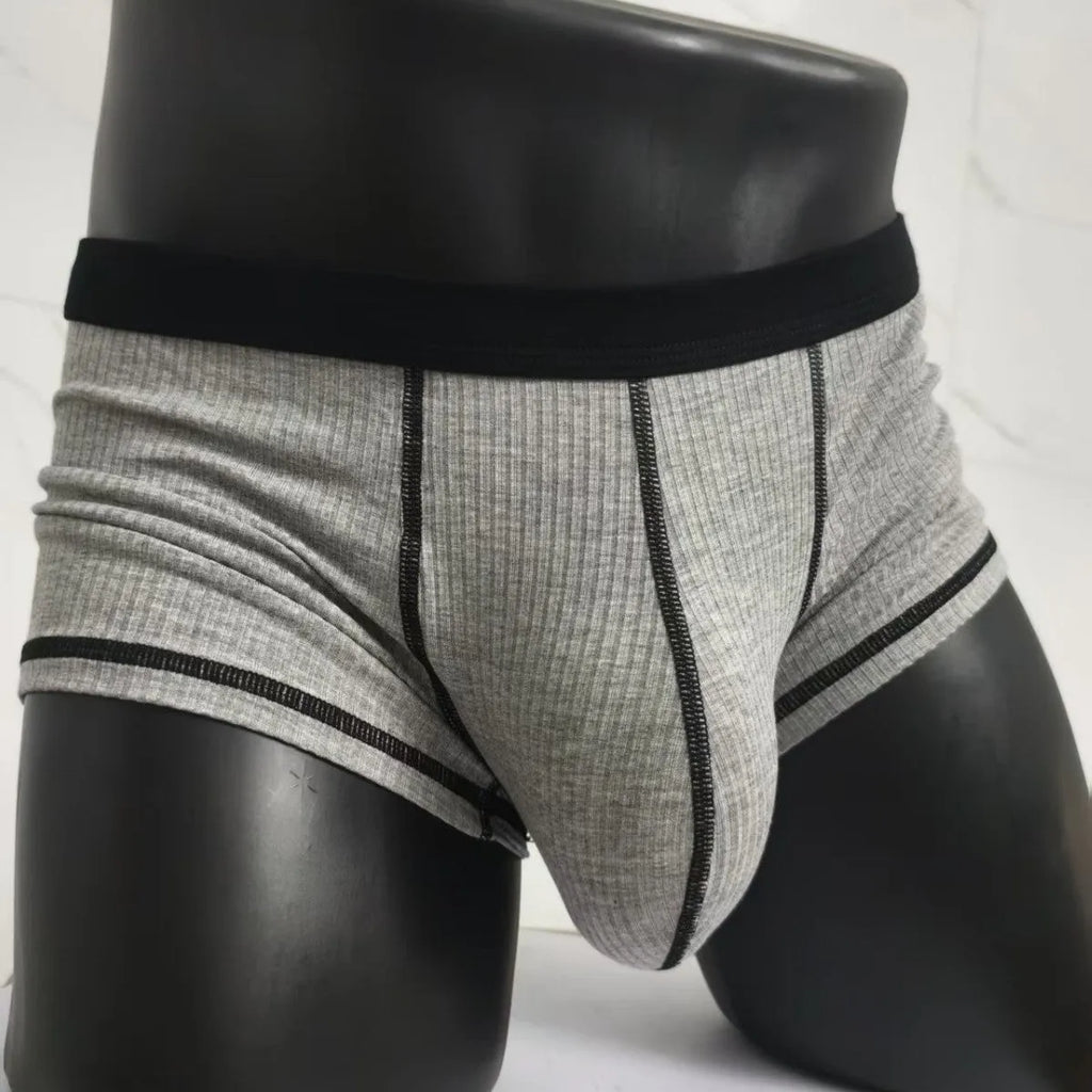 Solid colour men's boxer shorts in breathable fibre fabric, shown in Army Green.