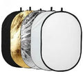 Collapsible 5-in-1 photography light reflector showing gold, silver, white, black, and translucent surfaces