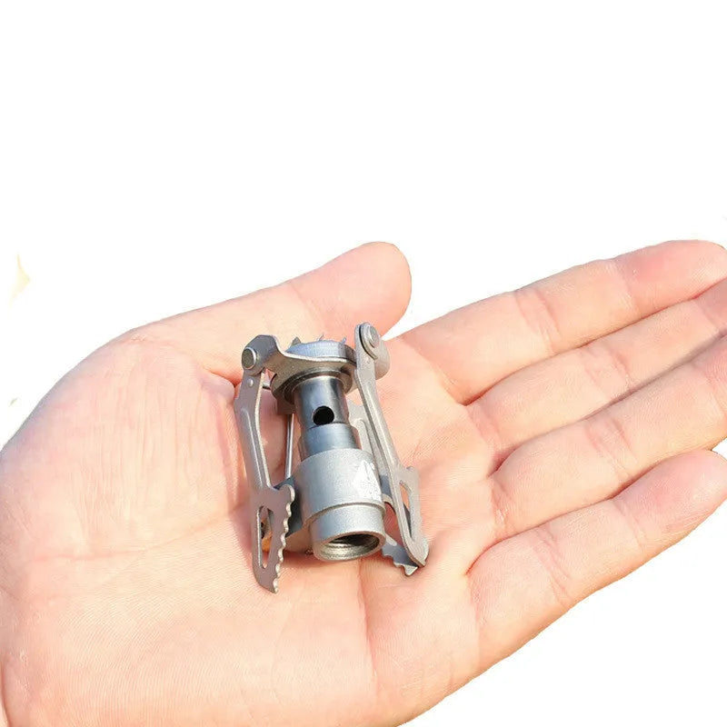 Portable gas camping stove with one-piece furnace design for outdoor use