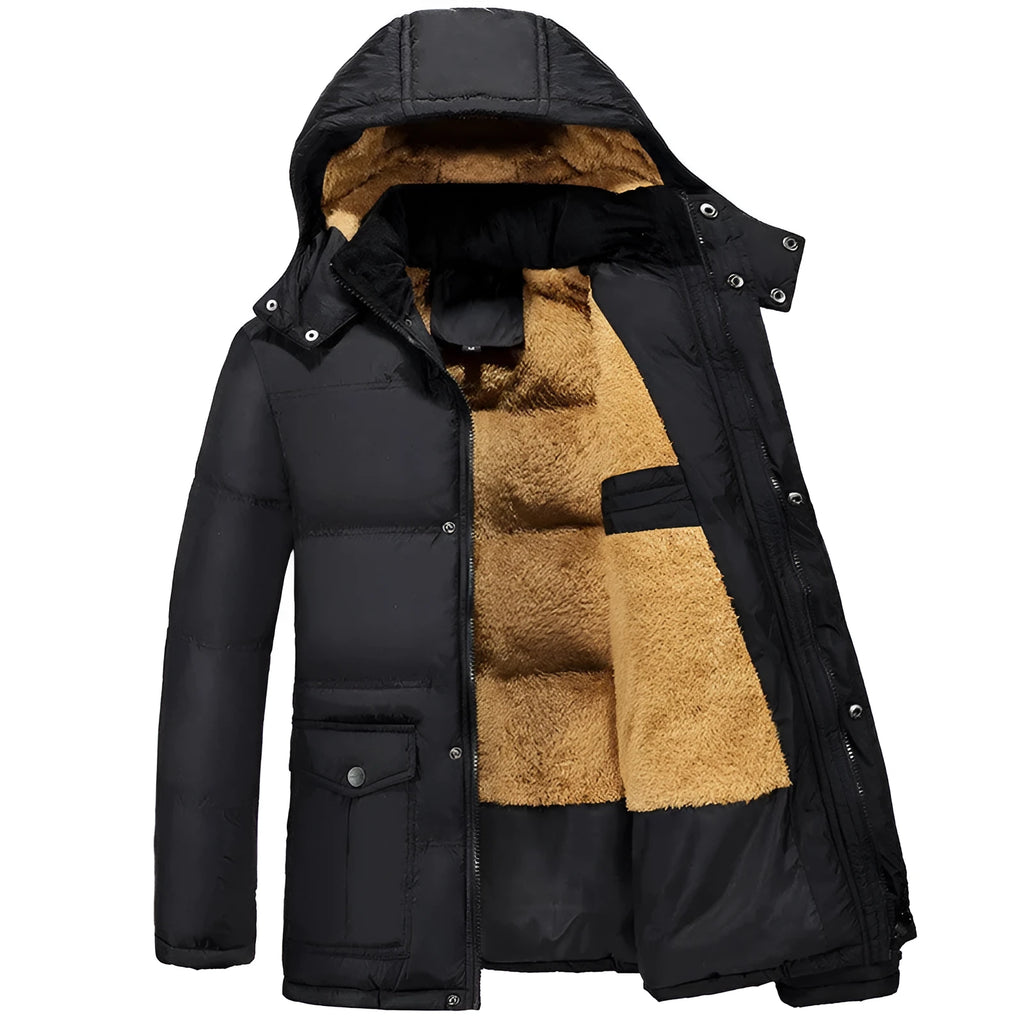 Man wearing a black double-breasted velvet padded hooded winter jacket.