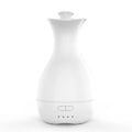 White ultrasonic aromatherapy diffuser and humidifier with colourful LED light misting on a wooden table.